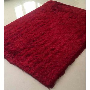 Emelda Burgundy Area Rug