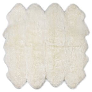 Eight Pelt Ivory Area Rug