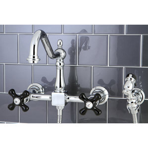 Kingston Brass Duchess Double Handle Centerset Wall Mounted Bridge Faucet with Side Spray